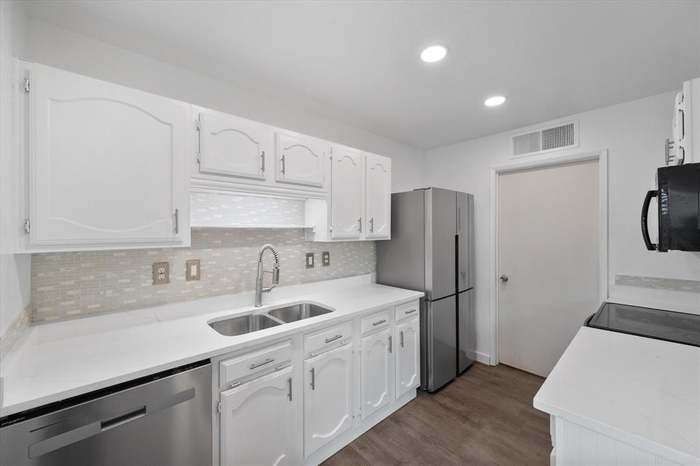 Finished kitchen with stainless appliances