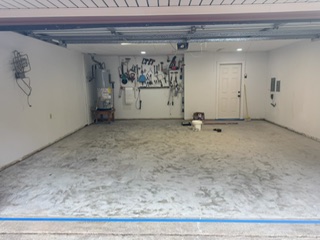 Garage floor swept and taped, ready for epoxy coating