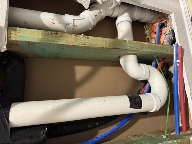 Plumbing rough-in behind wall