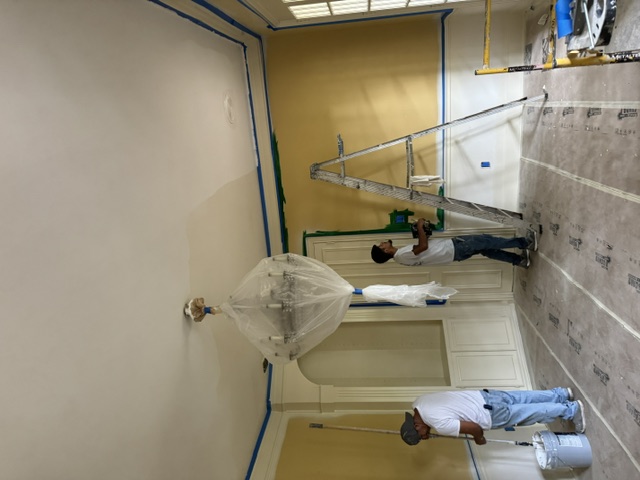 Keep n Buzy team painting a home interior