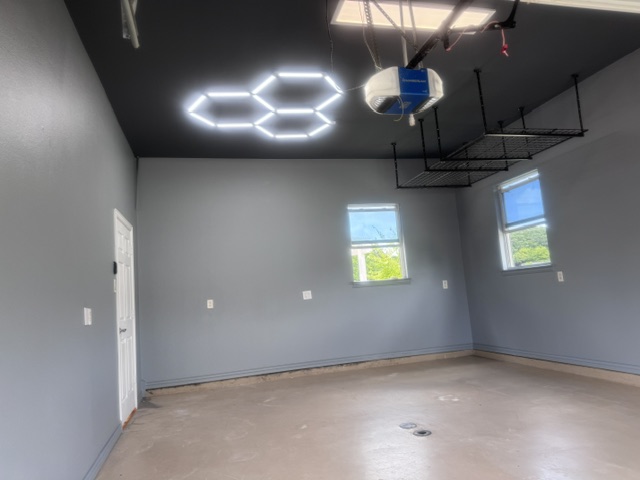 Garage with bare concrete floor before epoxy coating